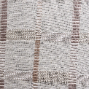 Macro shot of breathable plaid cotton fabric texture on a summer newsboy flat cap