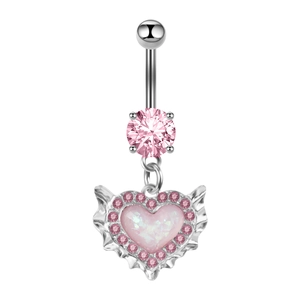 Close-up of a silver belly ring with a pink heart pendant and opal stone inlay