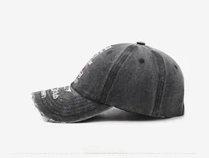 Detail shot of vintage washed baseball cap with distressed brim and white embroidery