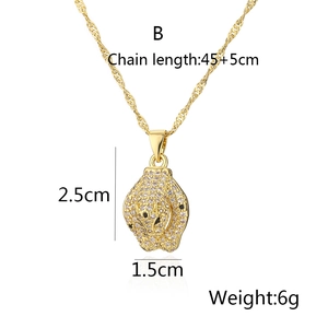 Detail view of a gold leopard pendant necklace with measurements and water wave chain