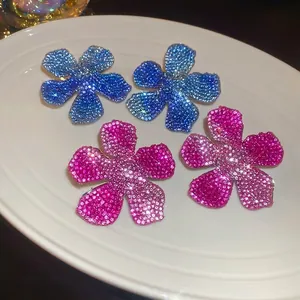 Elegant floral stud earrings featuring pink and blue gradient crystal pavé rhinestones
