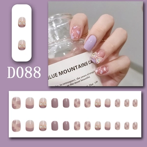 Detailed view of D088 purple press-on nails featuring resin bows and heart patterns