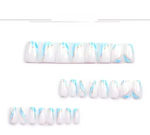 Detailed view of blue and white marble pattern nails with elegant gold glitter lines