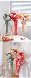 Close-up of Christmas Kraft paper flower wrap with reindeer prints and velvet ribbons