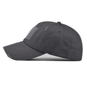 Close-up of distressed dark grey cotton baseball cap with American flag patch detail