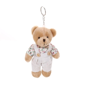 Linen teddy bear plush keychain with floral shirt and white suspenders on white background