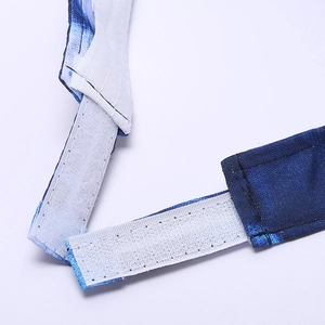 Detail of adjustable hook and loop closure on tie-dye gradient empty top hat for women