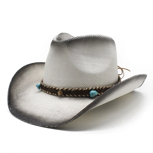Detail of woven straw cowboy hat featuring turquoise stone and brown braided cord band