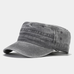Detail view of washed cotton cadet cap with side metal eyelets and stitched brim