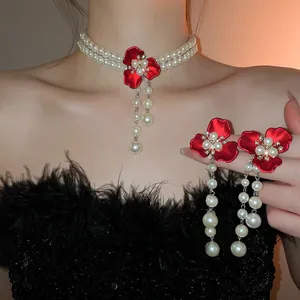Elegant vintage jewelry set with red flower pendants and multilayer pearl tassels