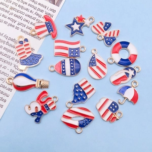 Detailed macro view of American flag enamel charms featuring stars, hats, and various shapes