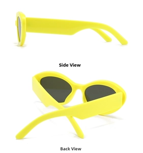 Detail view of bold yellow baroque sunglasses showing wide temples and dark grey lenses