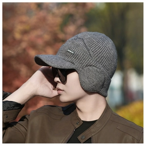 Detail showing grey winter knit hat with ear flaps and visor for outdoor wind protection