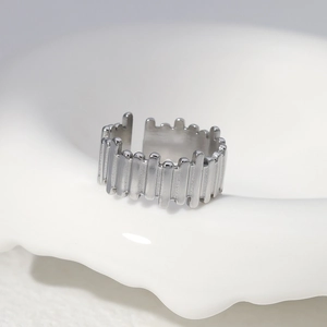 Detailed macro view of irregular vertical stripes on an adjustable silver steel ring