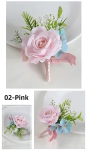 Detail of pink artificial rose boutonniere with blue accents and ribbon wrapped handle