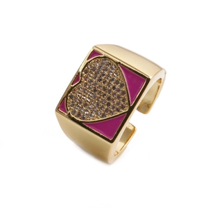 Golden heart ring with purple enamel and pavé zircons on a clean white background