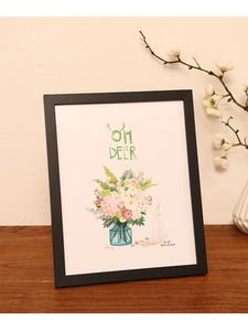 Modern black minimalist photo frame with 8x10 inch size detail in a home setting