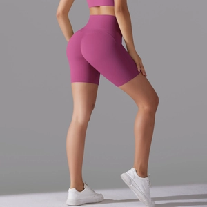 Detail view of high-waist rose pink seamless sports shorts with sculpting fit