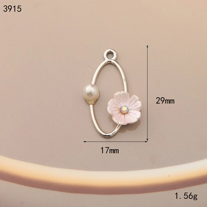 Detailed view of alloy oval pendant with pink flower, pearl, and 29mm size markings
