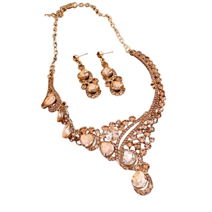 French vintage jewelry set featuring a diamond-studded round pendant necklace and earrings