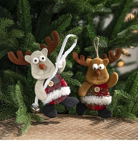 Close-up of felt reindeer ornaments with metal bells and plaid fabric on a Christmas tree