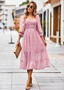 Detail of square neckline and elastic smocked bodice on pink floral midi dress