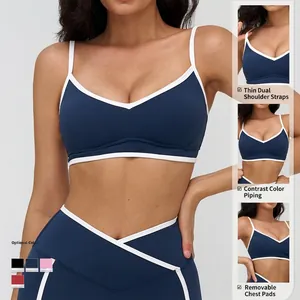 Navy blue V-neck sports bra set with dual straps and high waist leggings for yoga