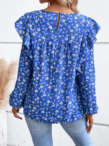 Detail view of floral long sleeve top featuring a back button closure and ruffle accents