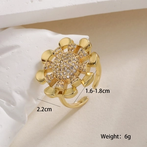 Detail of 18K gold sun ring with small diamonds and 2.2cm diameter measurement display
