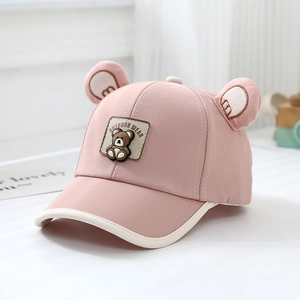 Close-up of pink baby baseball cap featuring 3D bear ears and outdoor bear patch