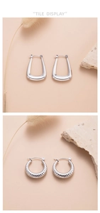 Detail display of silver hollow hoop earrings with sleek U-shape and croissant designs
