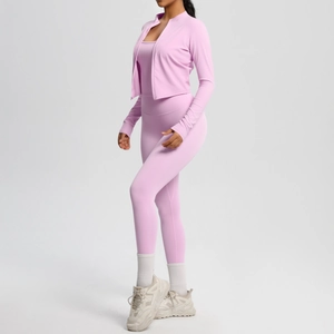 Three-piece pale pink yoga set featuring a zip jacket, sports tank, and high waist leggings