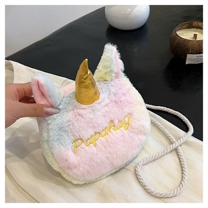 Detail of plush rainbow unicorn bag with golden horn and Papahug embroidery