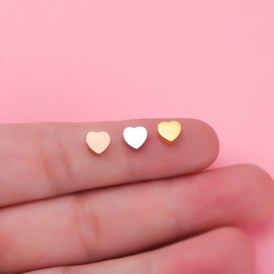 Mirror polished heart shaped stainless steel beads in rose gold, silver, and gold finish