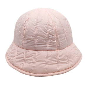 Detailed view of pink quilted down bucket hat with vertical stitching and padded fabric