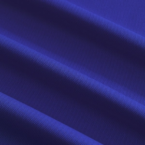 Close-up of royal blue breathable honeycomb mesh fabric on a short sleeve polo shirt