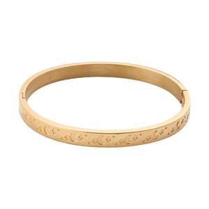 Gold stainless steel bangle with engraved moon and stars celestial pattern