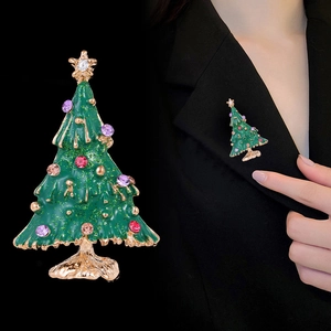 Christmas tree brooch with green enamel and colored rhinestones in gold setting