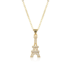 Close-up of golden Eiffel Tower pendant with sparkling CZ stones and elegant reflections