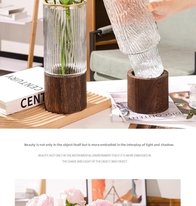 Close-up of textured glass vase with a solid wood base in a modern home decor setting