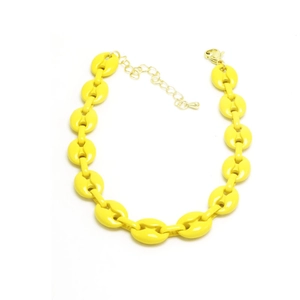 Detail of vibrant yellow coffee bean link bracelet with golden lobster clasp and chain
