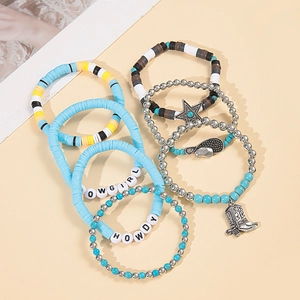 Detail of multi-layer Western Cowgirl bracelets with turquoise beads and charms