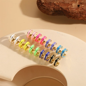 Colorful enamel C-shaped hoop earrings with gold metal base in various vibrant colors