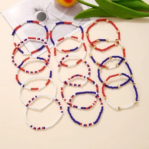 Set of 12 red white and blue beaded bracelets with gold star accents for Independence Day