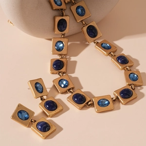 Vintage gold square necklace and earrings set with oval deep blue resin gemstones