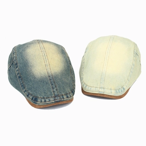 Retro denim newsboy caps in dark blue and cream with brown suede contrast brims