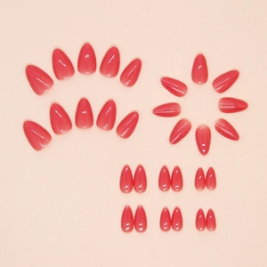 Red gradient almond press-on nails with jelly finish and high gloss on pink background