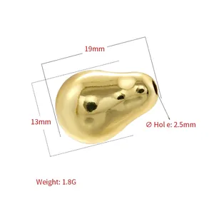 Detailed view of an irregular golden baroque bean bead with a high-polished mirror finish