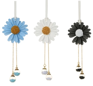 Detailed close-up of handmade daisy car charms with glass balls and gold chains