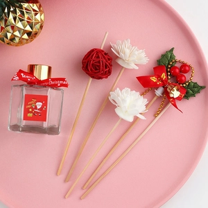 Christmas reed diffuser set with Merry Christmas red label and festive decorations